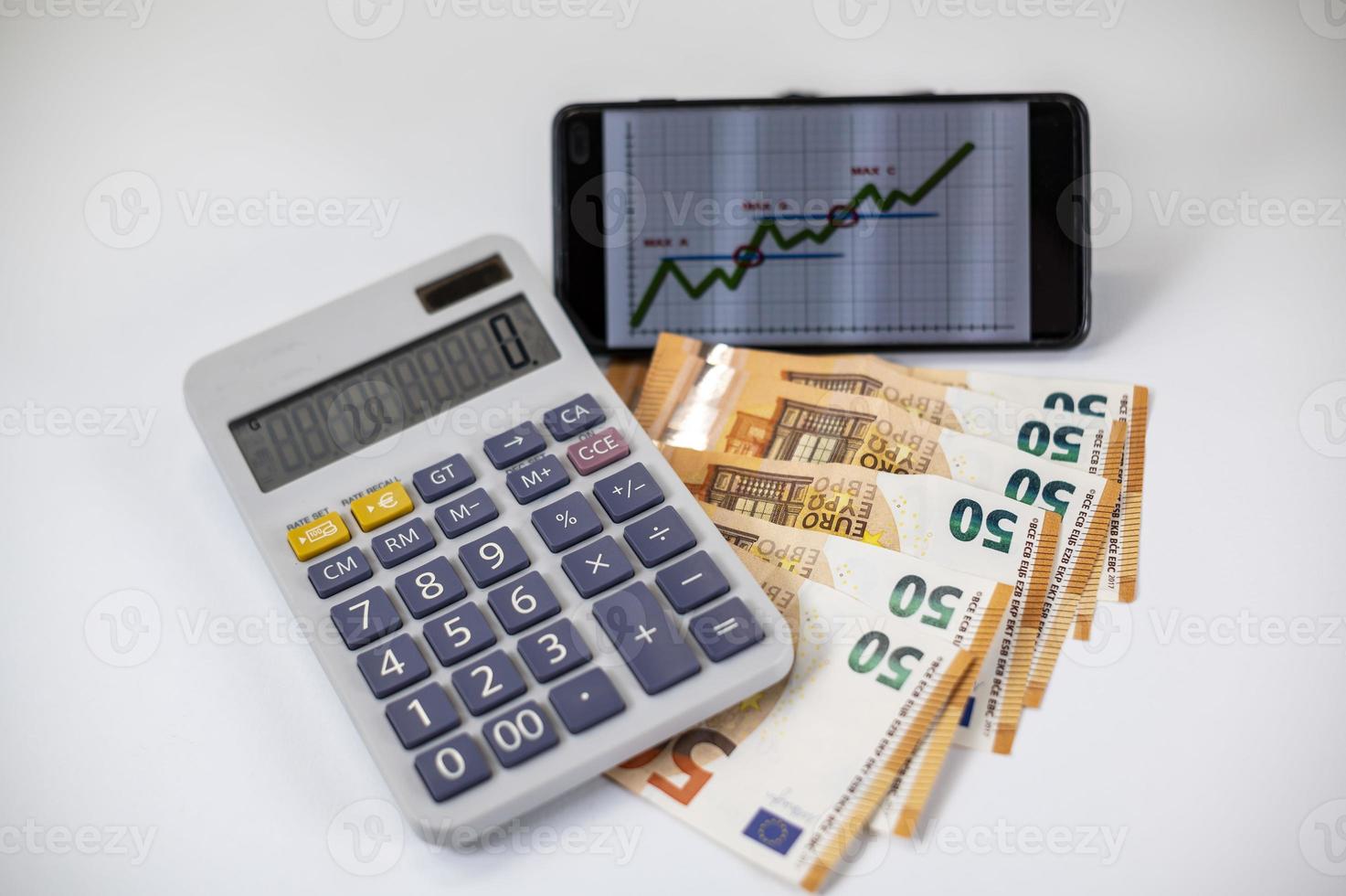 euro banknotes with calculator and graph photo