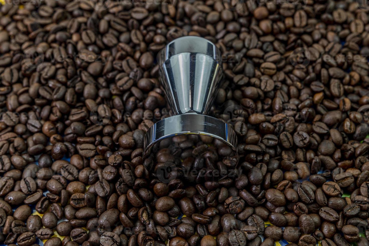 coffee beans with steel coffee press photo