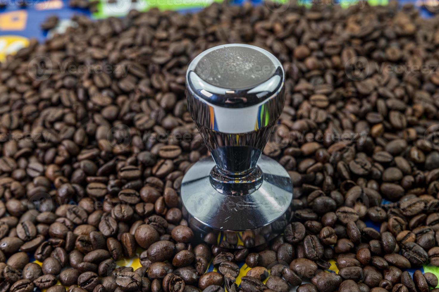 coffee beans with steel coffee press photo
