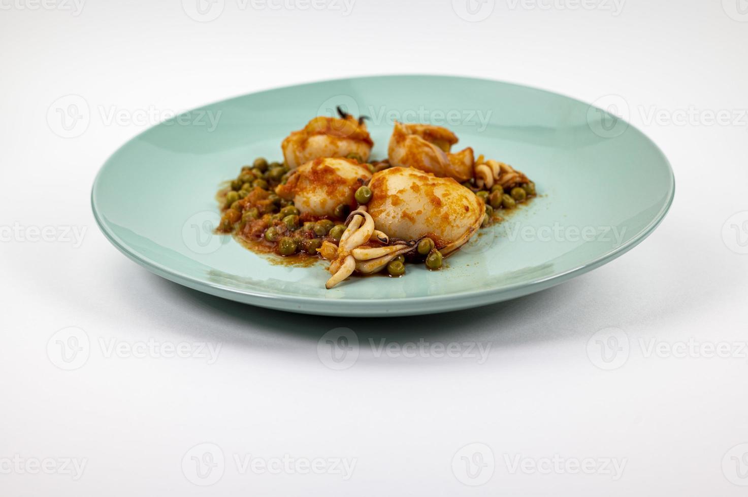 second course with cuttlefish and tomato peas photo