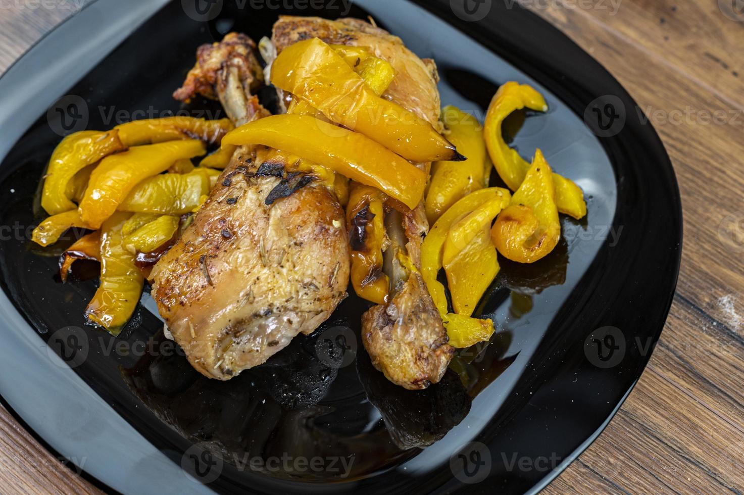 chicken legs and yellow peppers photo