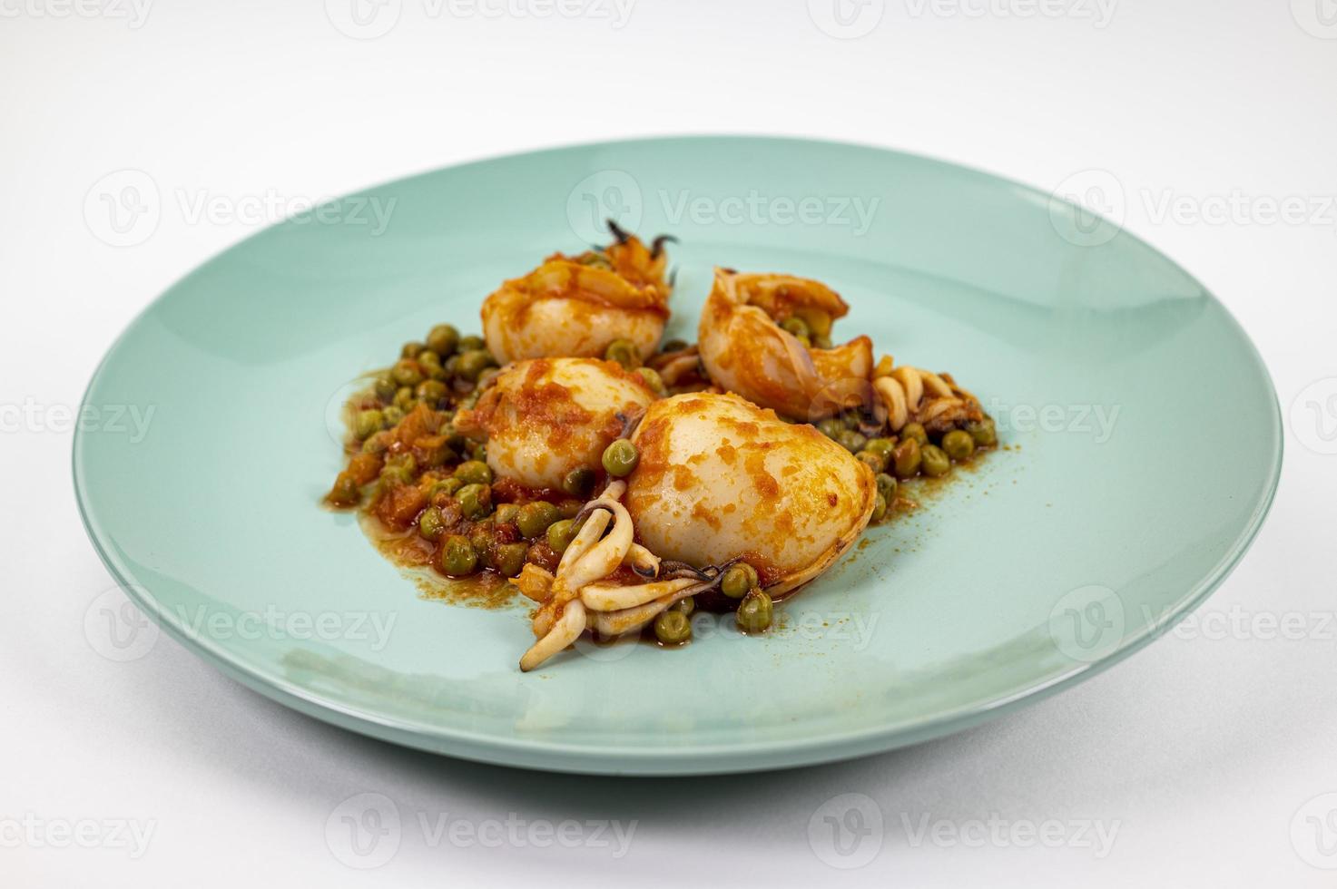 second course with cuttlefish and tomato peas photo