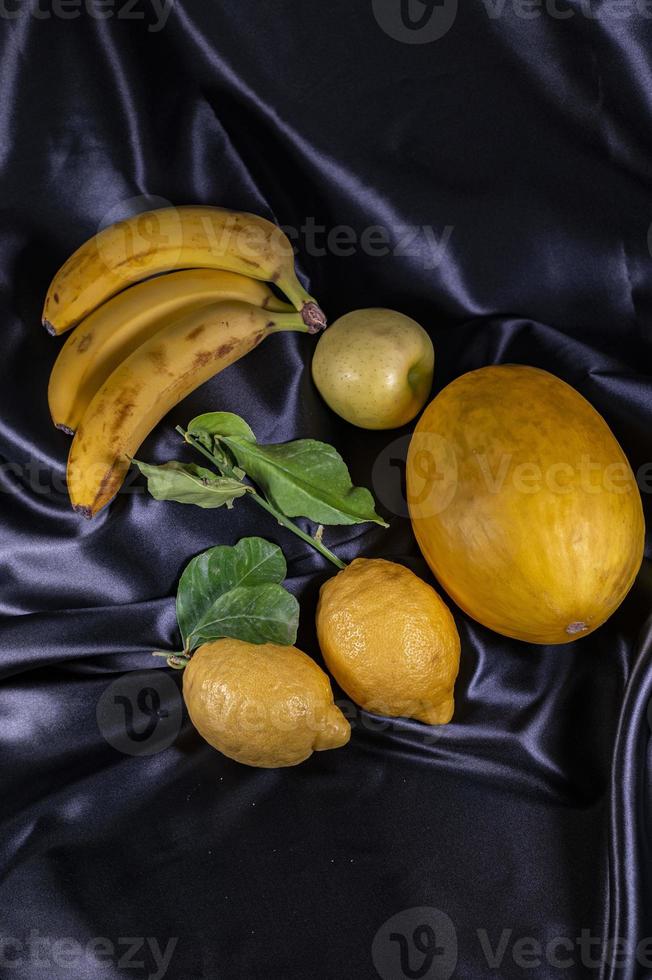 yellow fruit on a black background photo