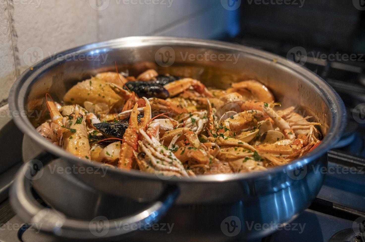 fresh fish soup with scampi and seafood photo