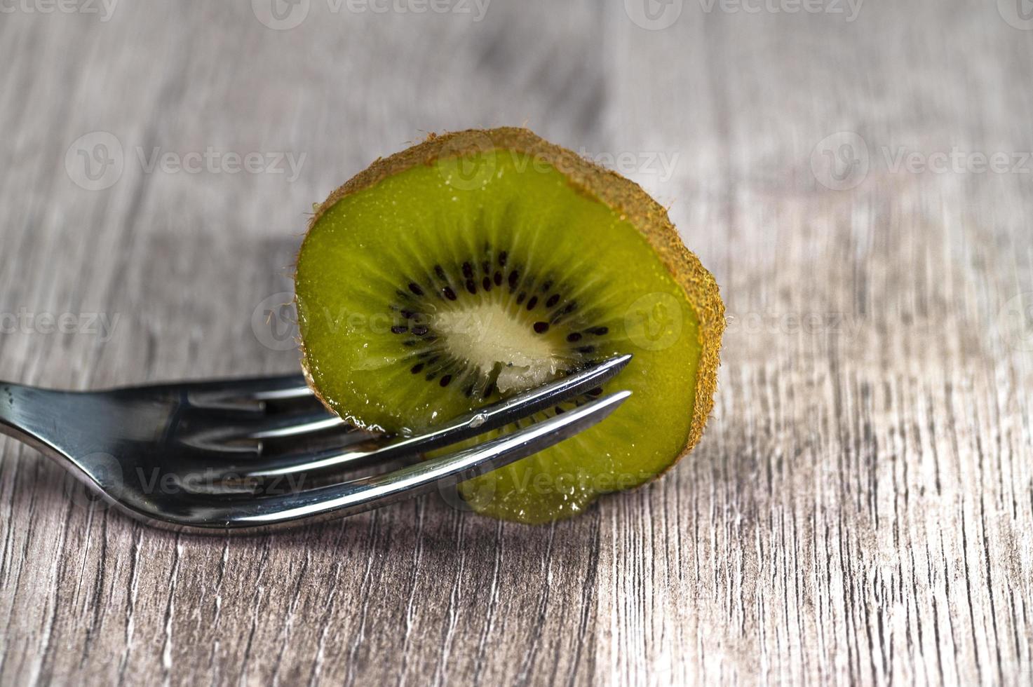 composition with kiwi and forks photo