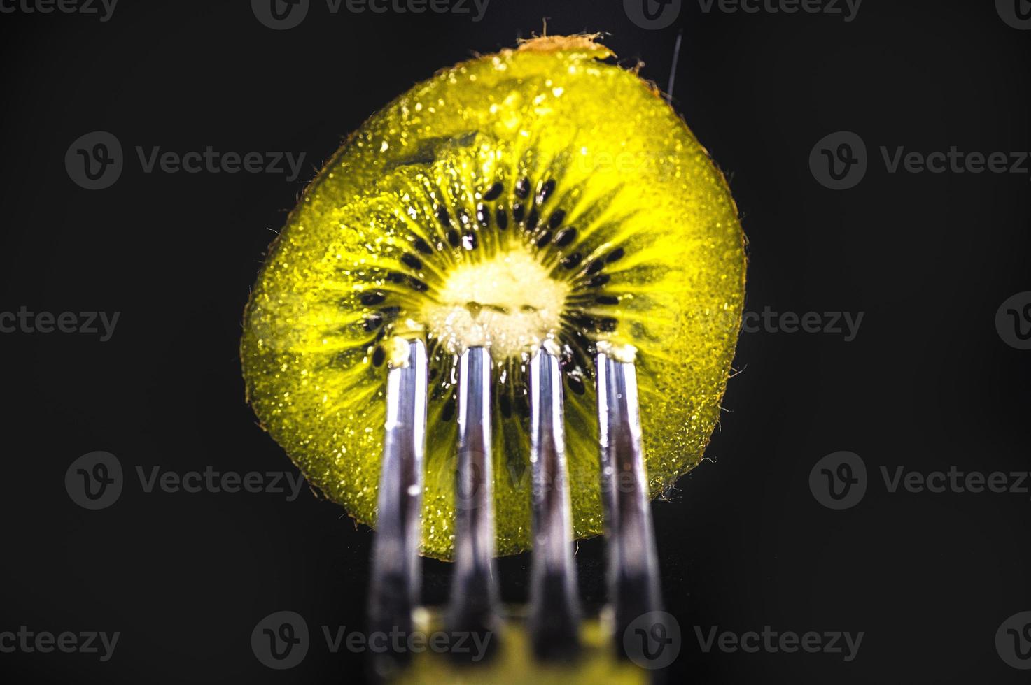 composition with kiwi and forks photo