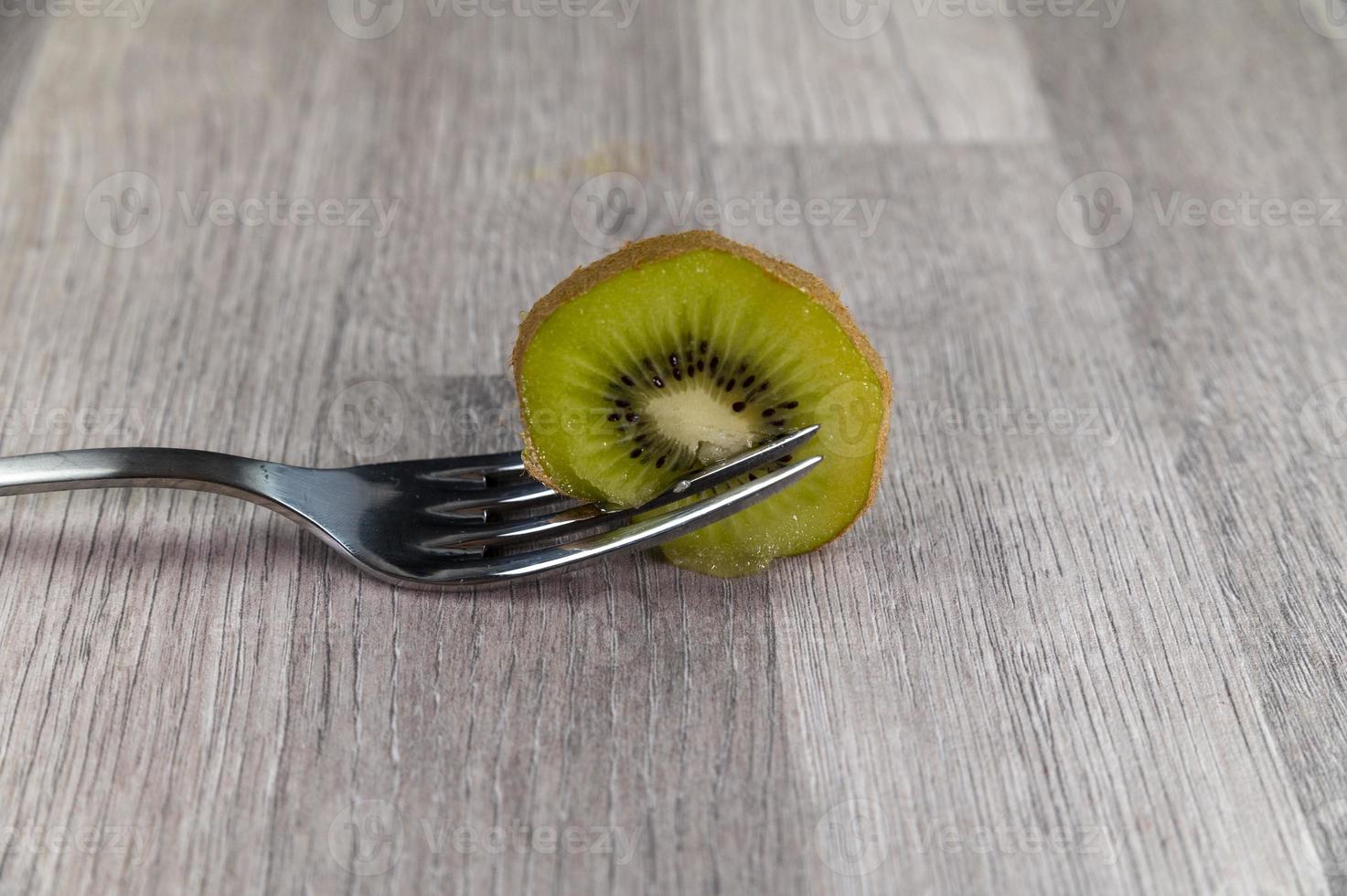 composition with kiwi and forks photo