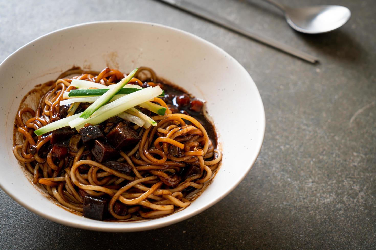 Jajangmyeon or JJajangmyeon is Korean Noodle with Black Sauce photo