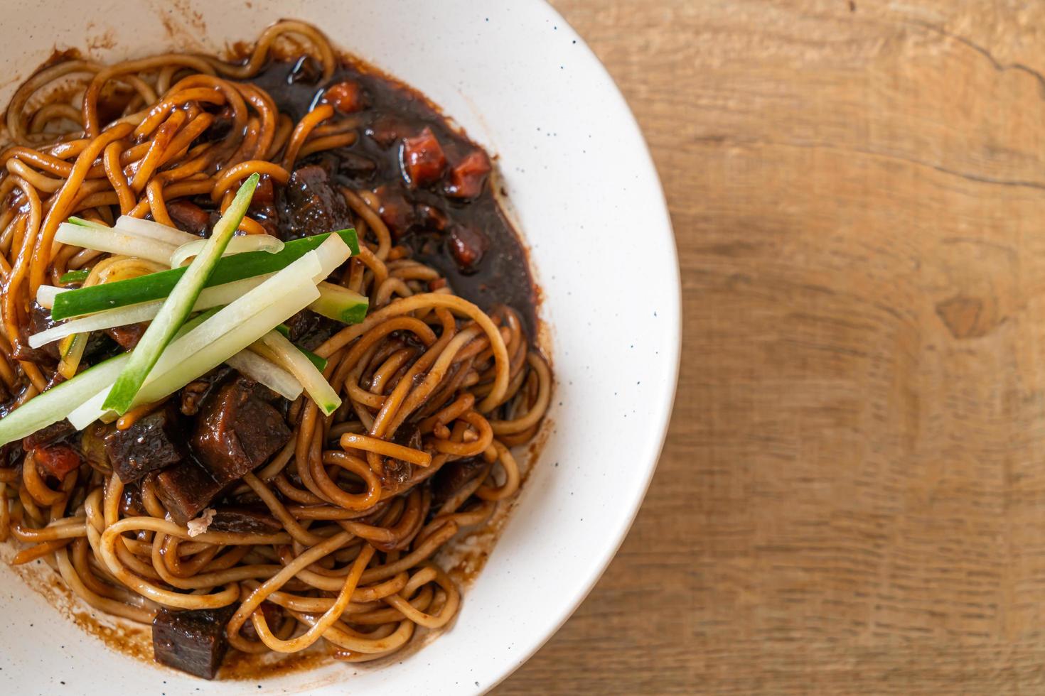 Jajangmyeon or JJajangmyeon is Korean Noodle with Black Sauce photo