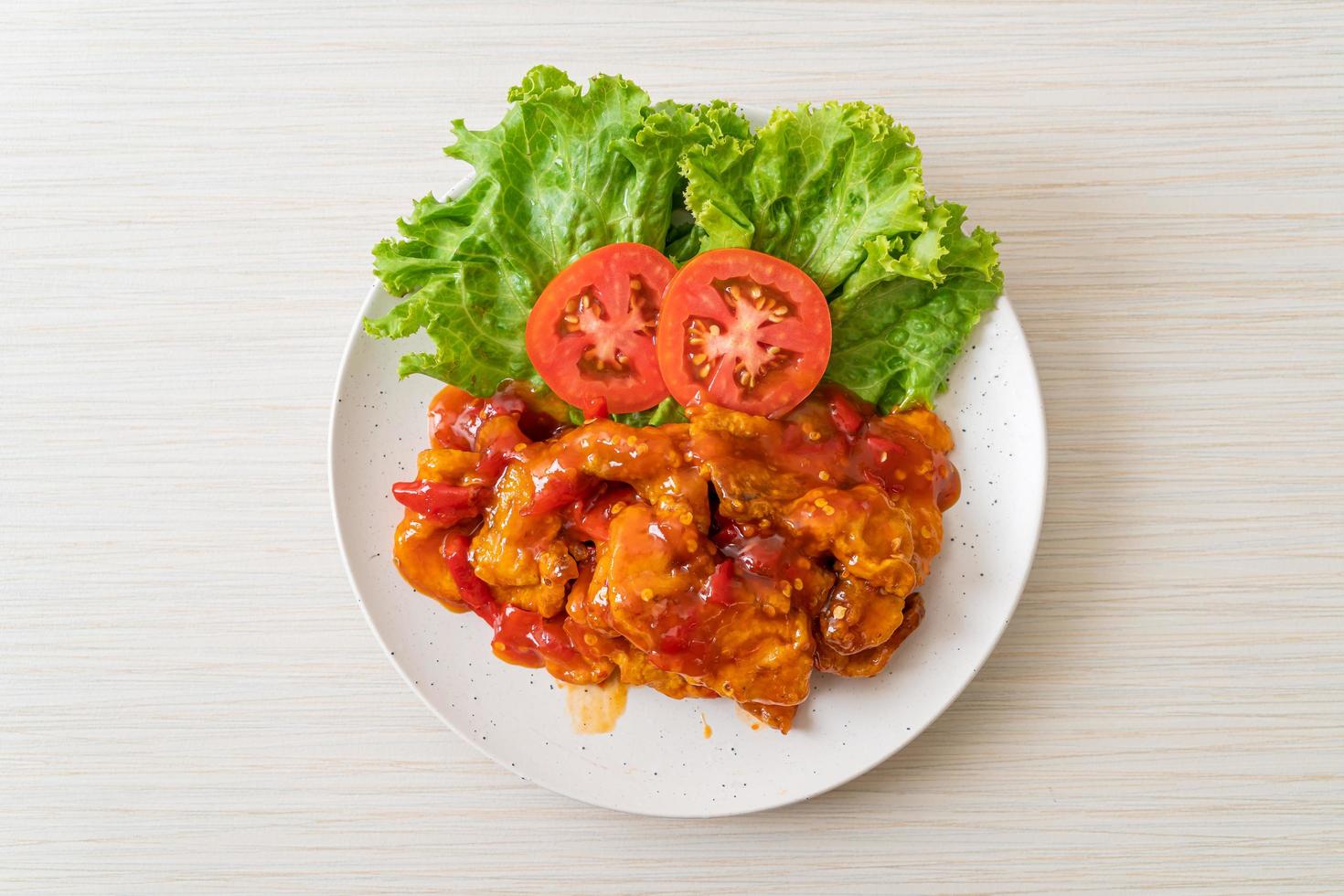 Fried fish topped with 3 flavors chili sauce photo