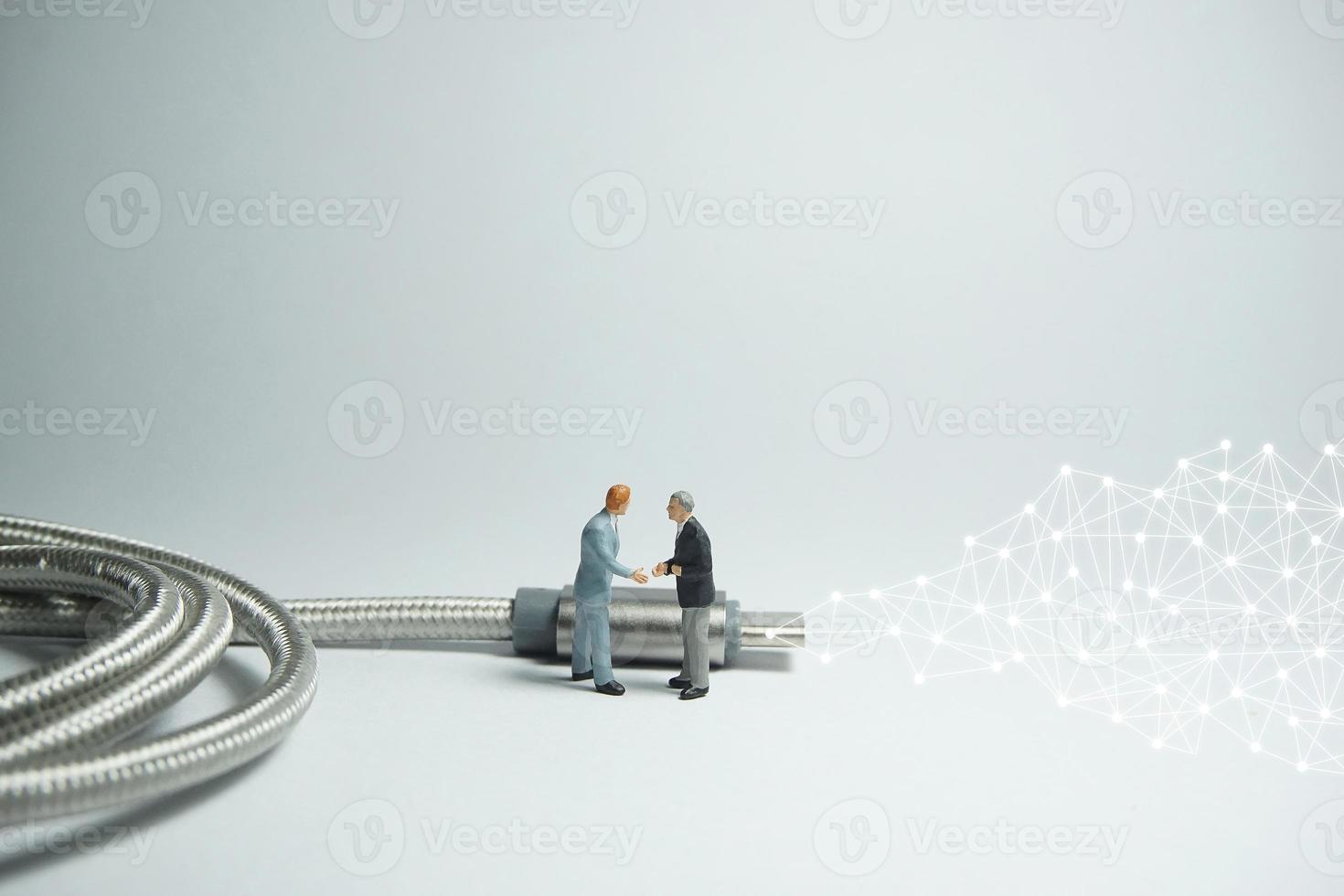 Businessman figure standing in front of usb USB type C cable. E commerce concept. photo