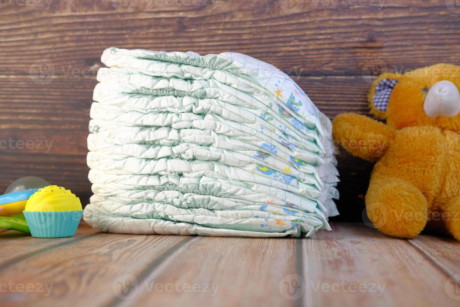 Stack of baby diaper on table, photo