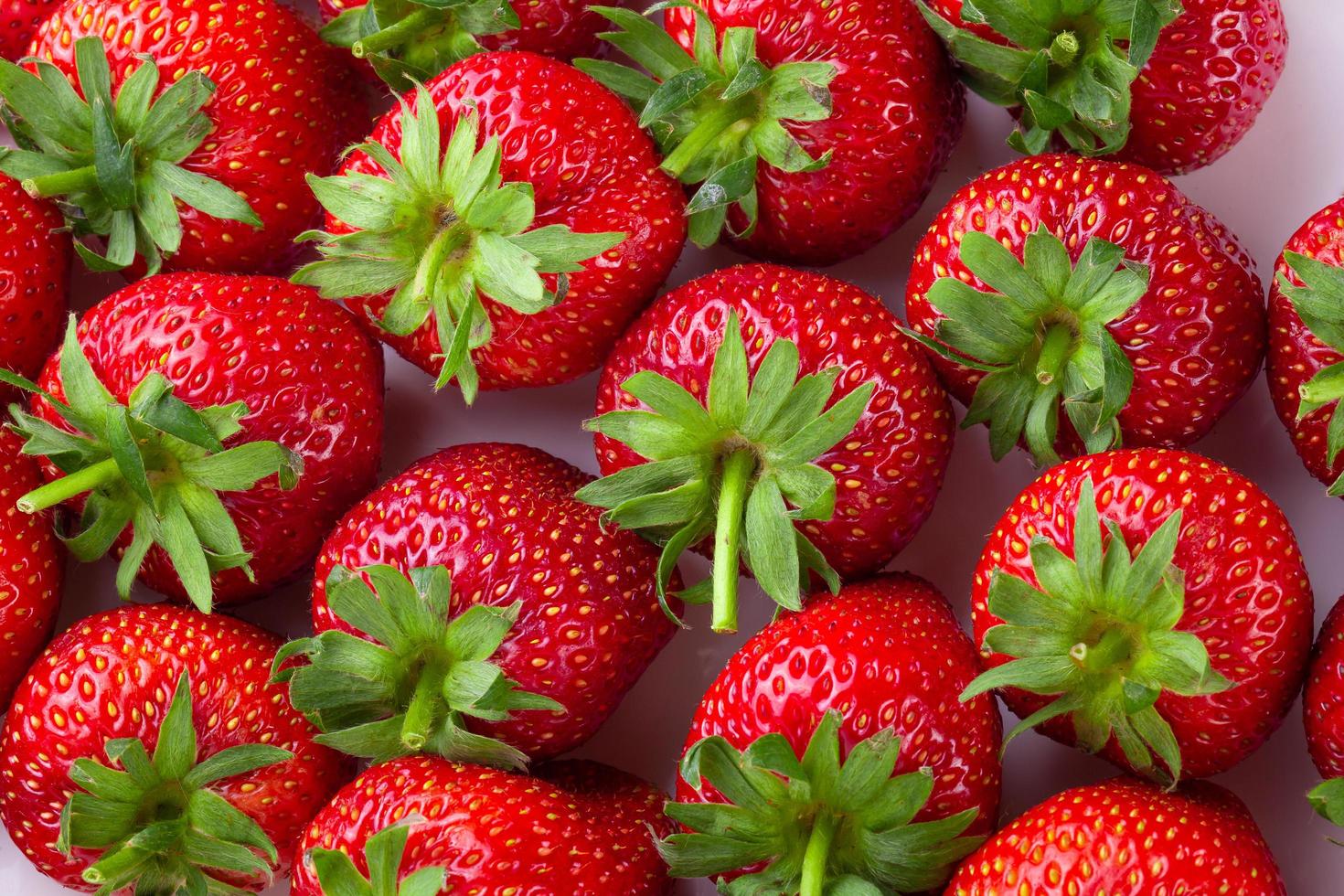 Juicy sweet strawberies isolated on white background photo