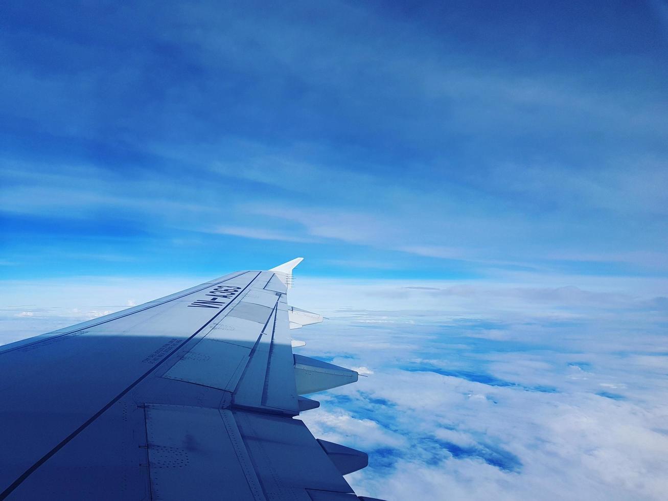 The blue sky and jet wing photo