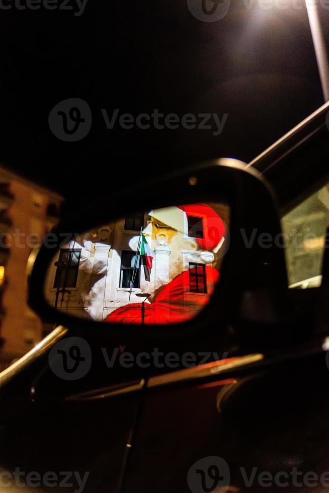 Santa Claus reflected in a car mirror photo