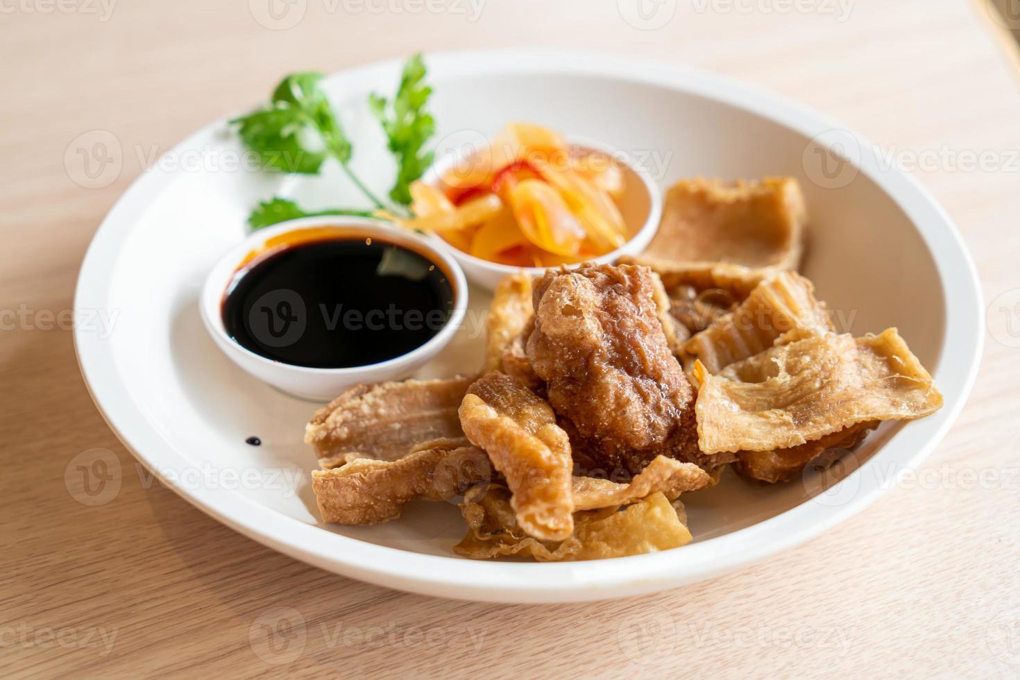 Deep fried pork intestines with sweet black sauce photo