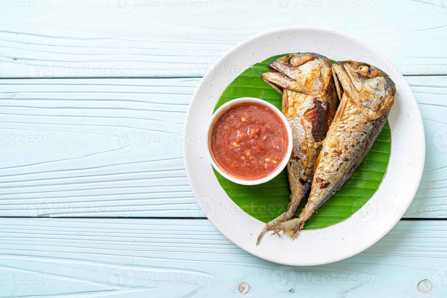 Fried mackerel fish with spicy shrimp paste sauce photo