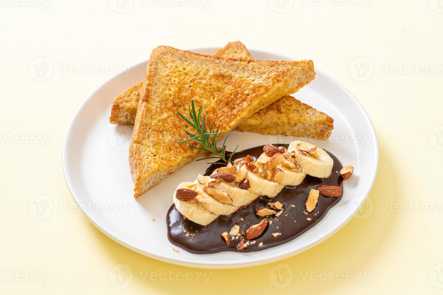 French toast with banana chocolate almonds photo