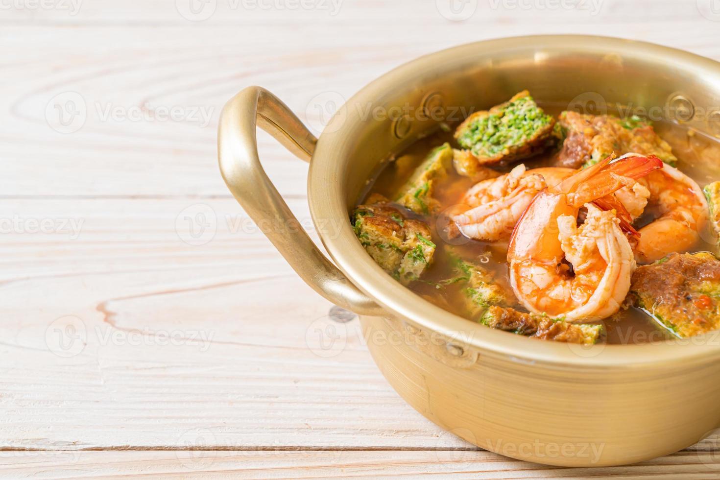 Sour soup made of Tamarind Paste with Shrimps and Vegetable Omelet photo