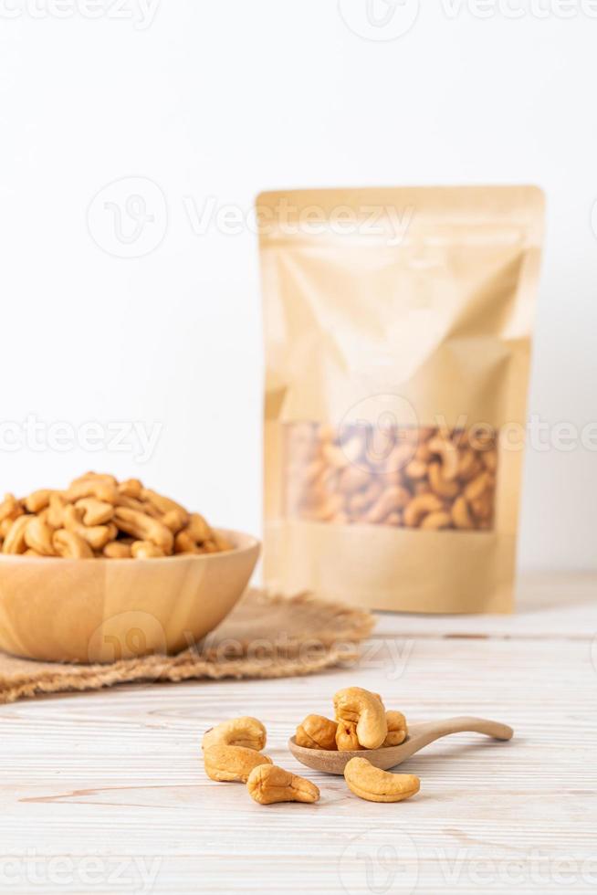 Cashew nuts in wooden bowl photo