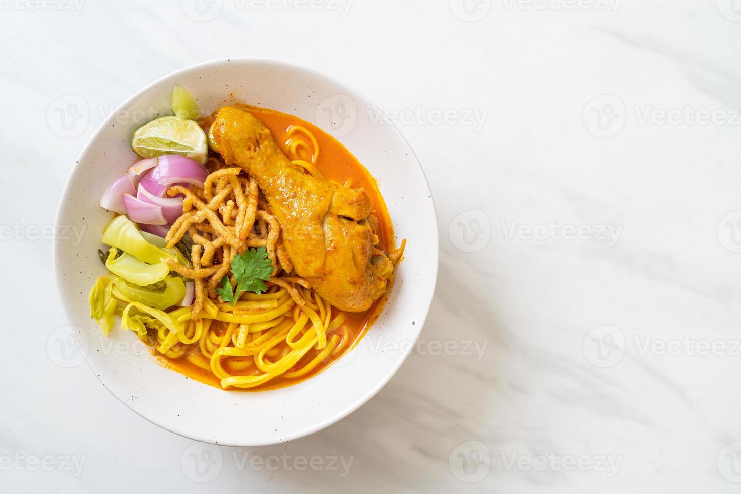 Northern Thai noodle curry soup with chicken photo