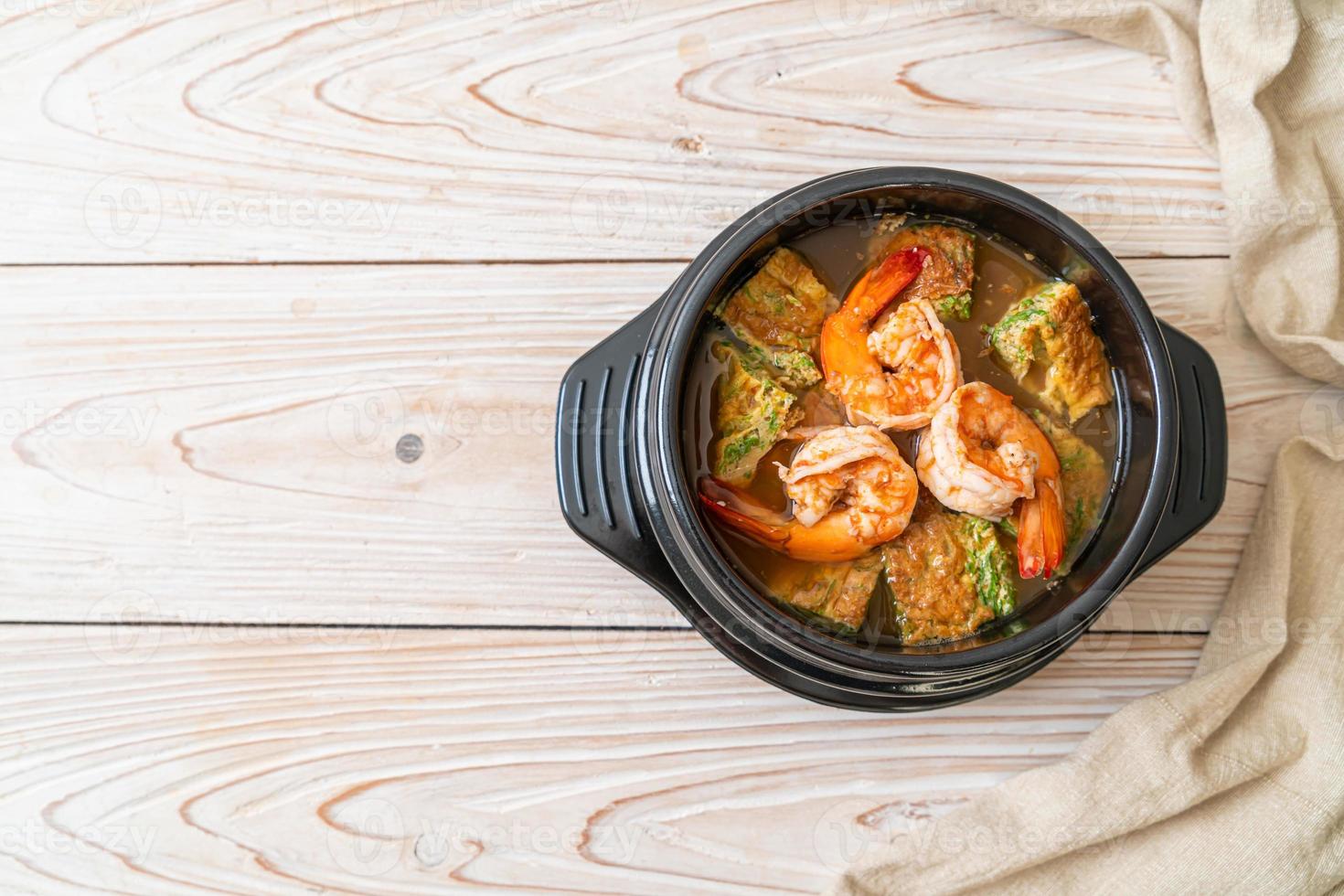 Sour soup made of Tamarind Paste with Shrimps and Vegetable Omelet photo