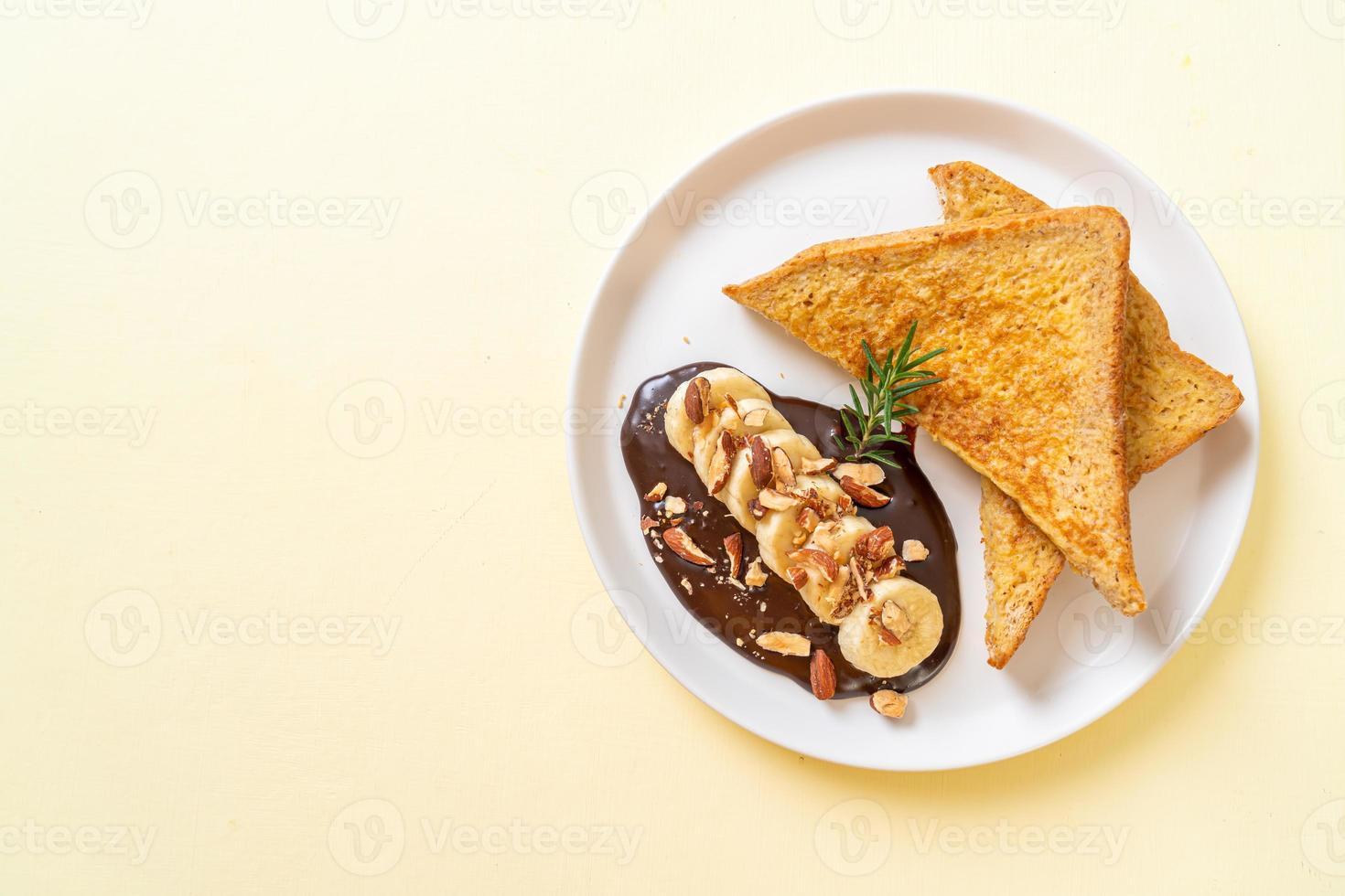 French toast with banana chocolate almonds photo