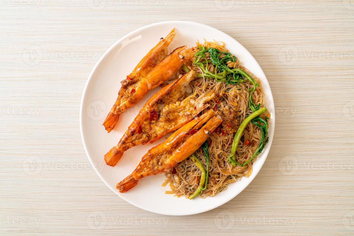 Stir-fried rice vermicelli and water mimosa with river prawns photo