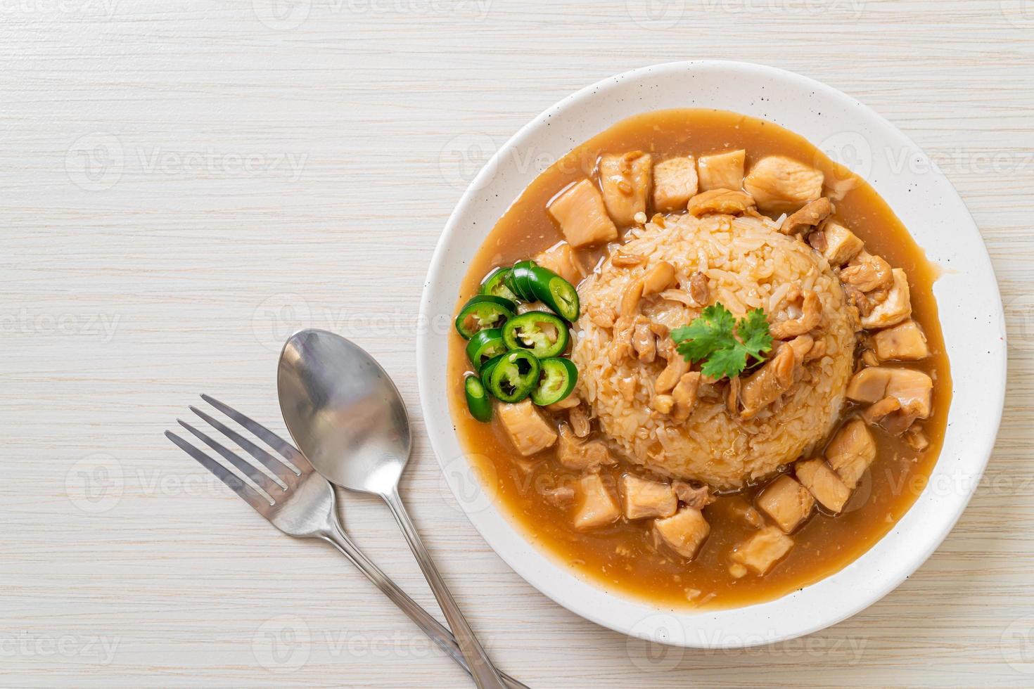 Chicken in brown sauce or gravy sauce with rice photo