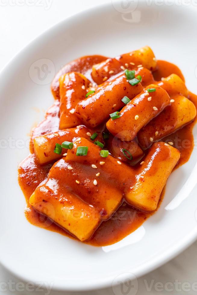 Korean rice cake stick in spicy sauce - Tteokbokki photo