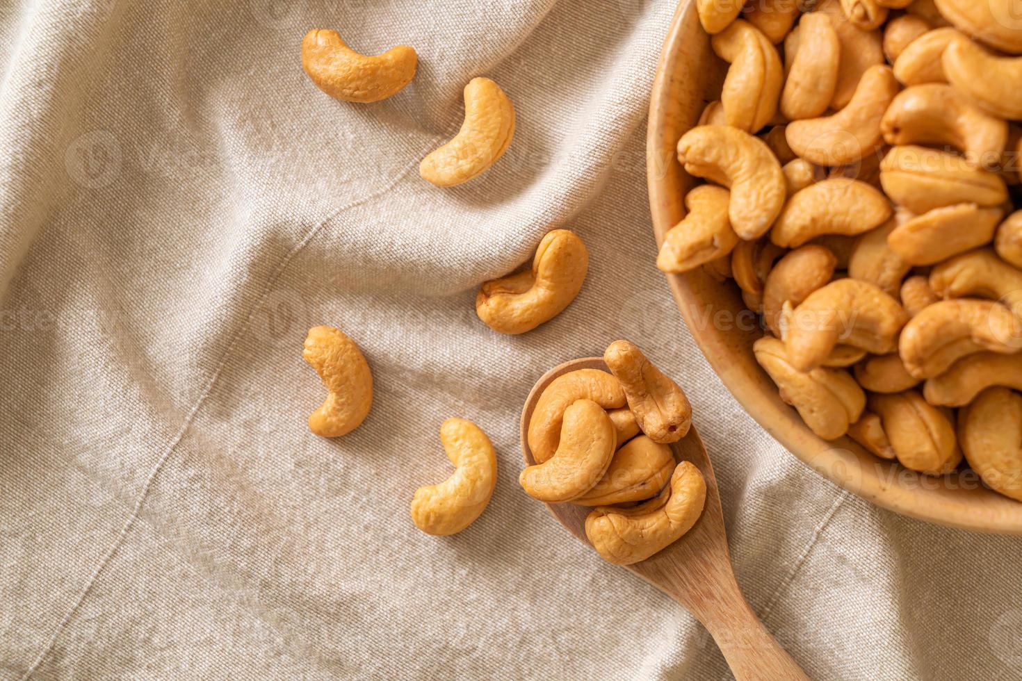 Cashew nuts in wooden bowl photo