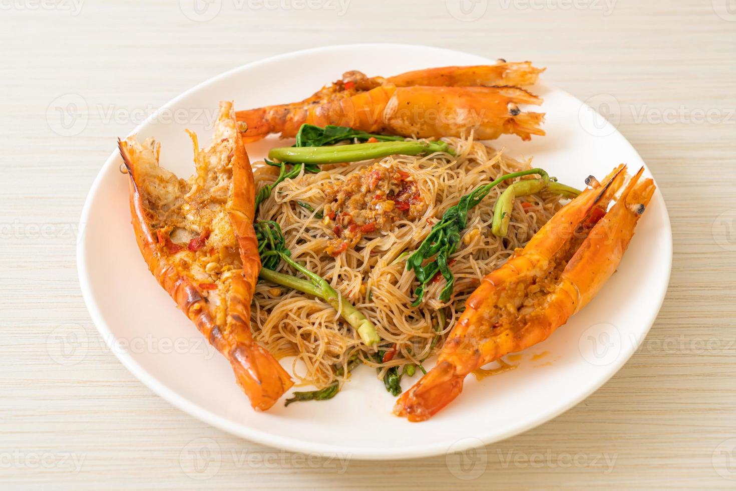 Stir-fried rice vermicelli and water mimosa with river prawns photo