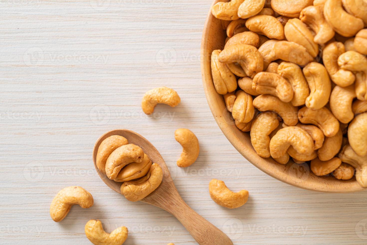 Cashew nuts in wooden bowl photo