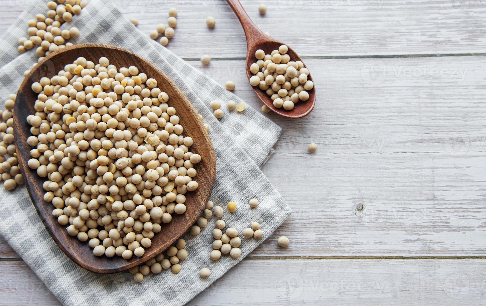 Soybeans on a wooden plate photo