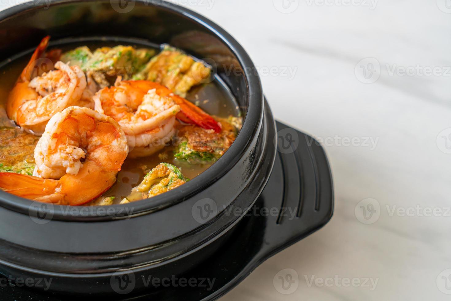 Sour soup made of Tamarind Paste with Shrimps and Vegetable Omelet photo