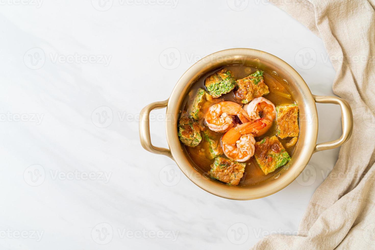 Sour soup made of Tamarind Paste with Shrimps and Vegetable Omelet photo