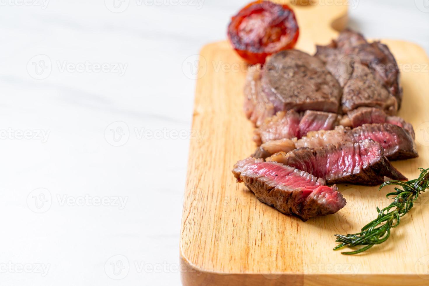 Grilled medium rare beef steak photo