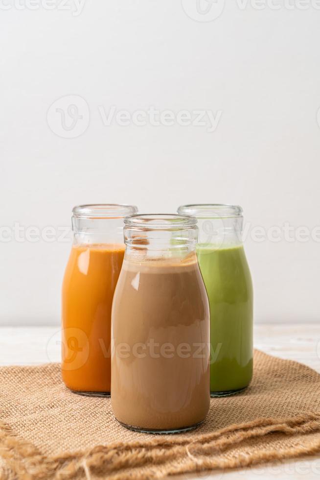 Thai milk tea, matcha green tea latte and coffee in bottle photo