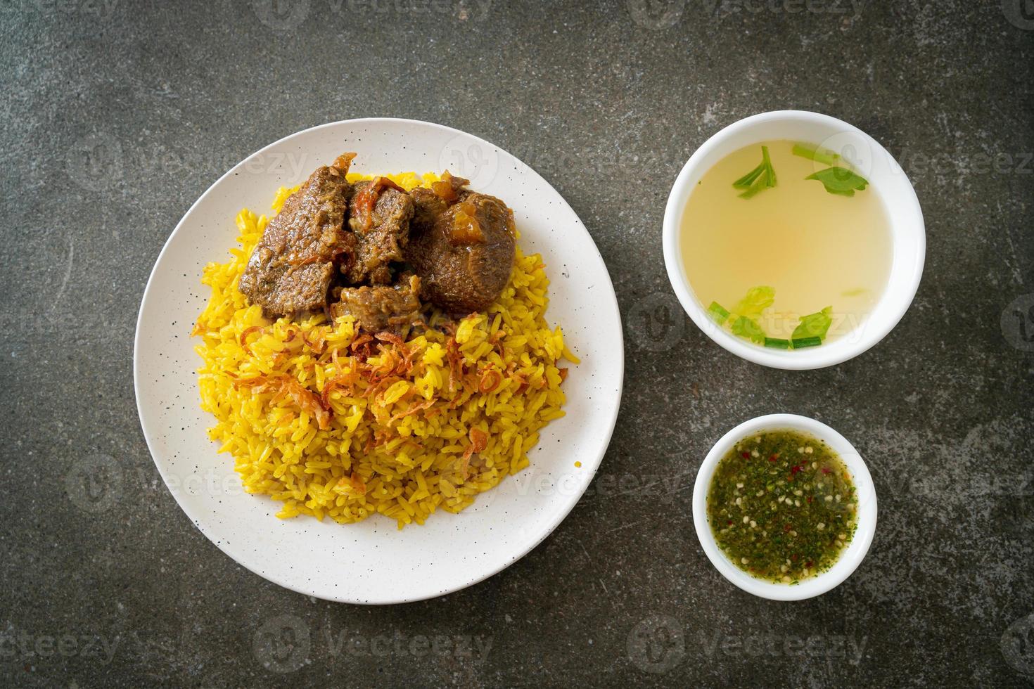 Beef Biryani or Curried rice and beef - Thai-Muslim version of Indian biryani, with fragrant yellow rice and beef photo