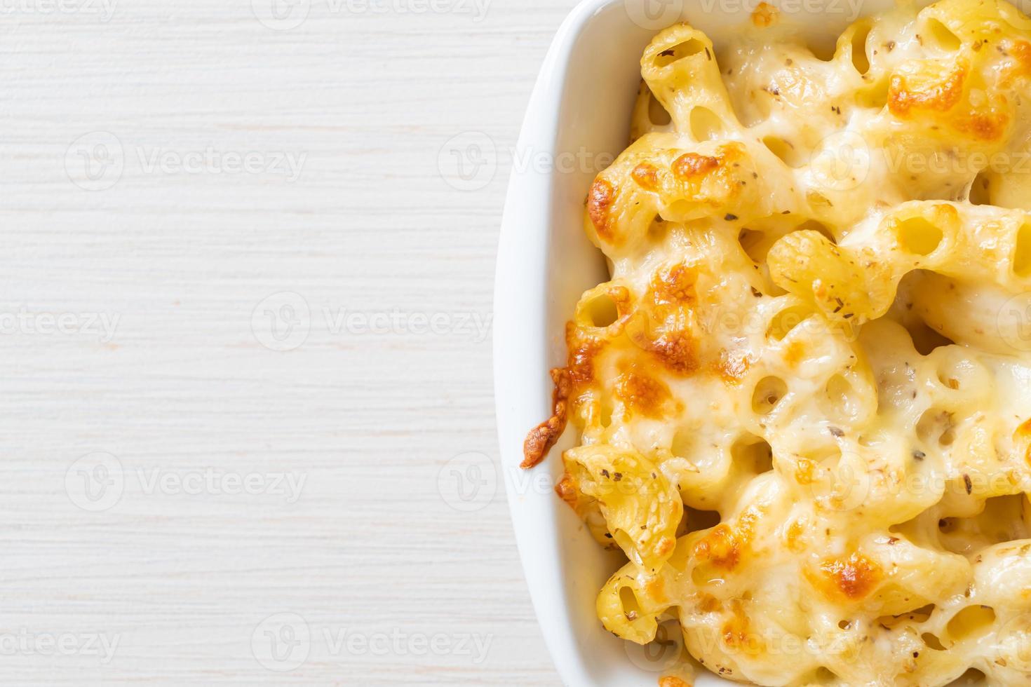 American mac and cheese, macaroni pasta in cheesy sauce photo