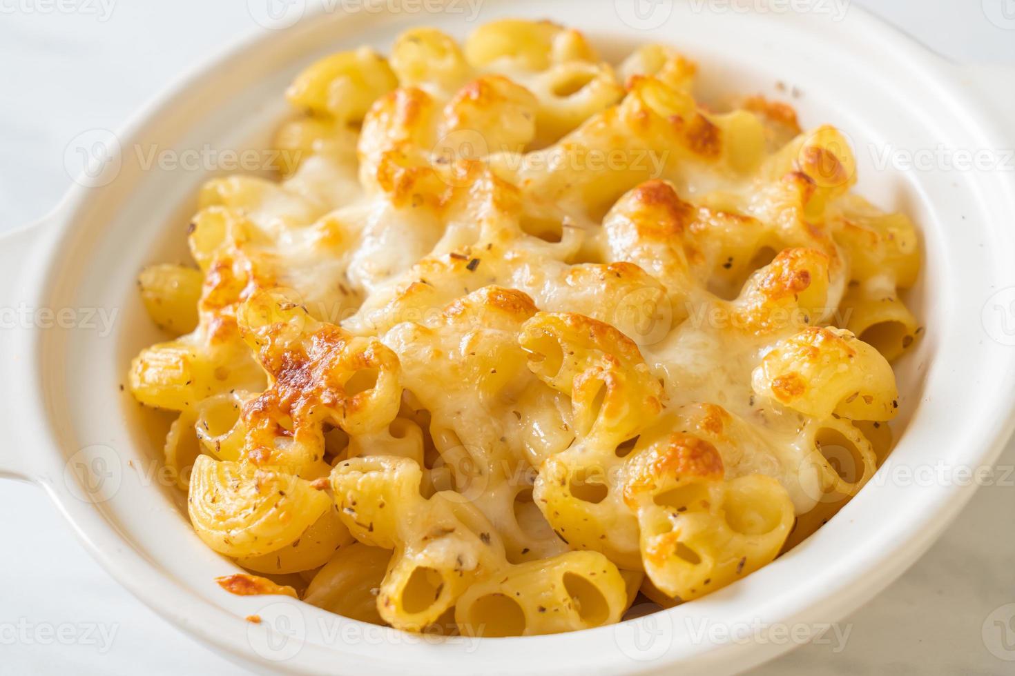 American mac and cheese, macaroni pasta in cheesy sauce photo