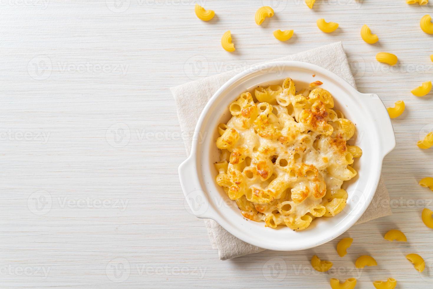 American mac and cheese, macaroni pasta in cheesy sauce photo