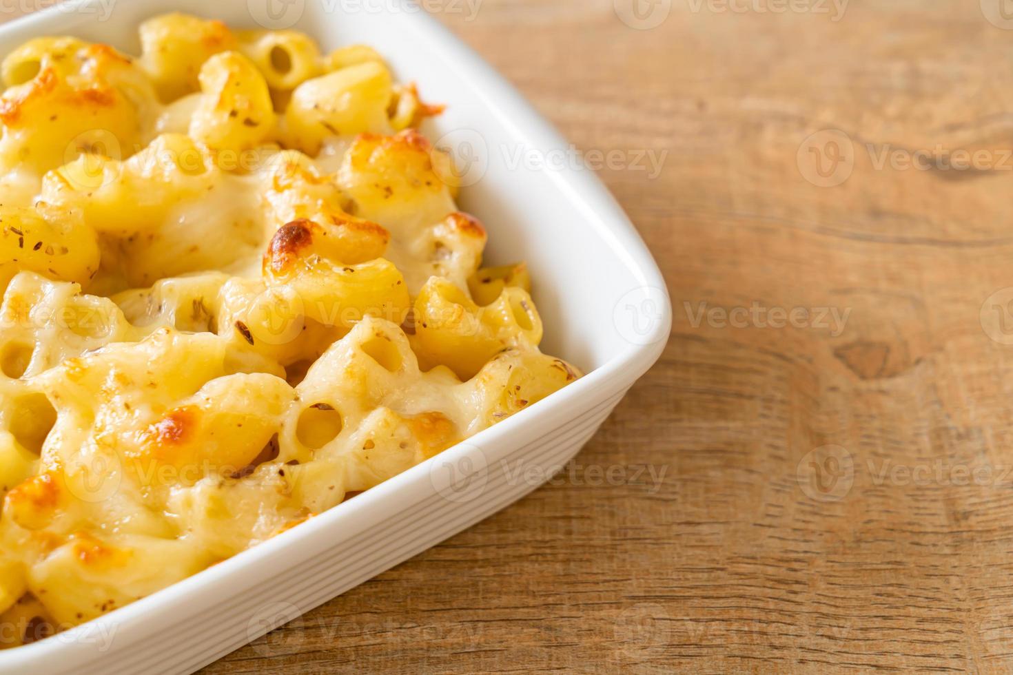 American mac and cheese, macaroni pasta in cheesy sauce photo