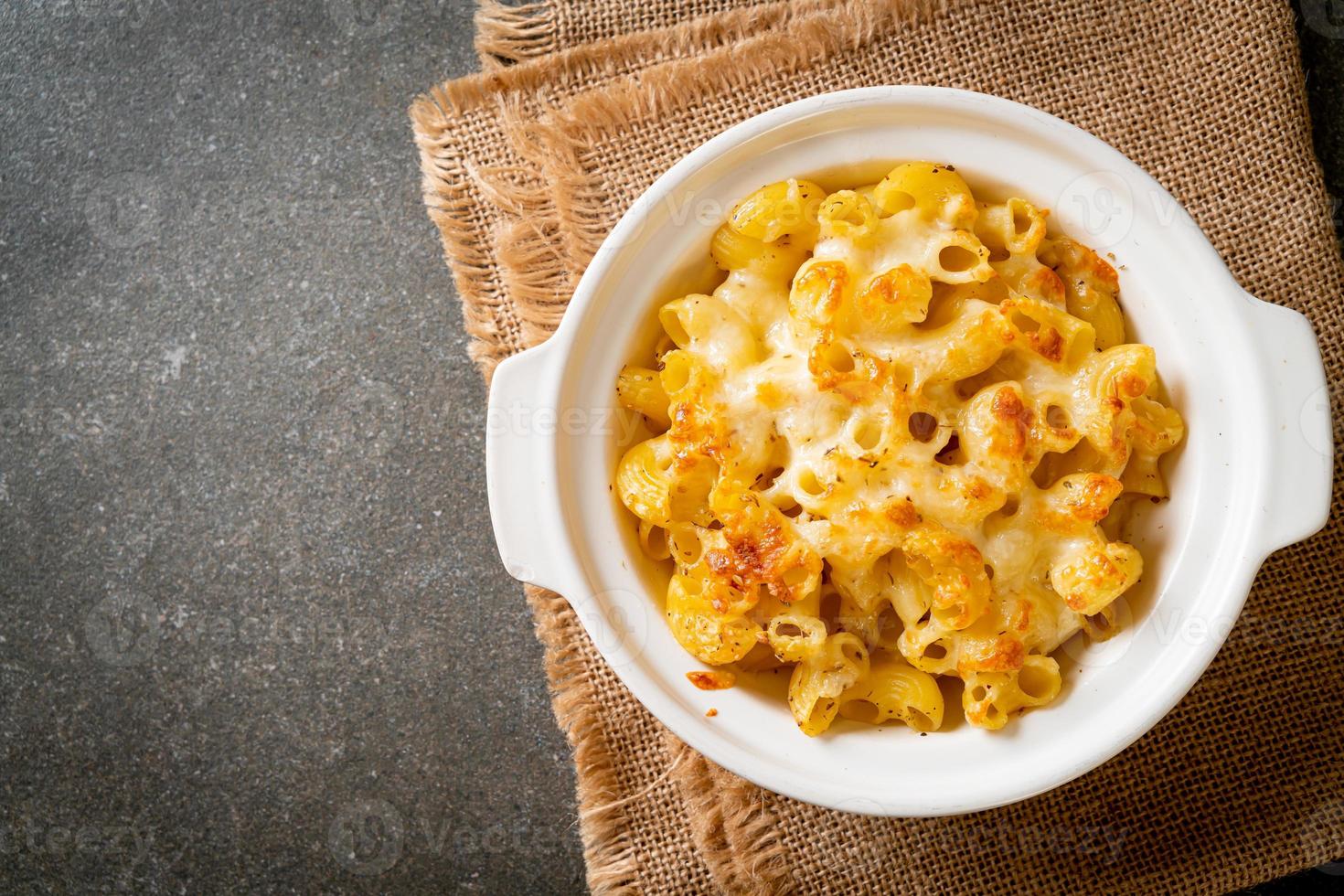 American mac and cheese, macaroni pasta in cheesy sauce photo