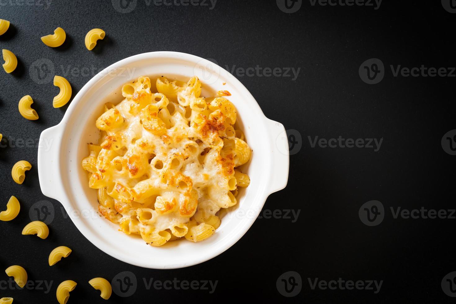 American mac and cheese, macaroni pasta in cheesy sauce photo