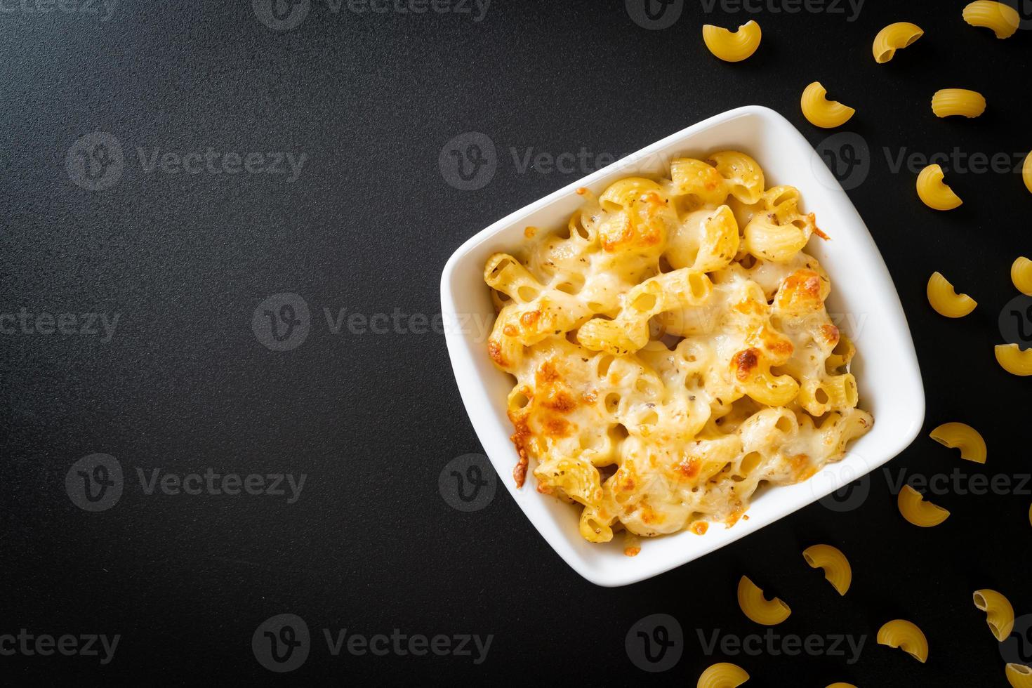 American mac and cheese, macaroni pasta in cheesy sauce photo