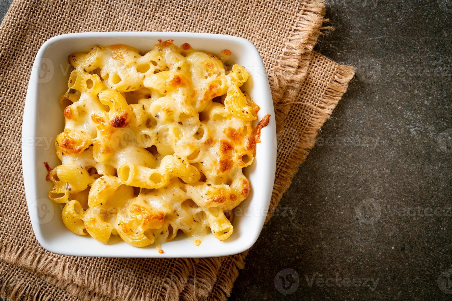 American mac and cheese, macaroni pasta in cheesy sauce photo