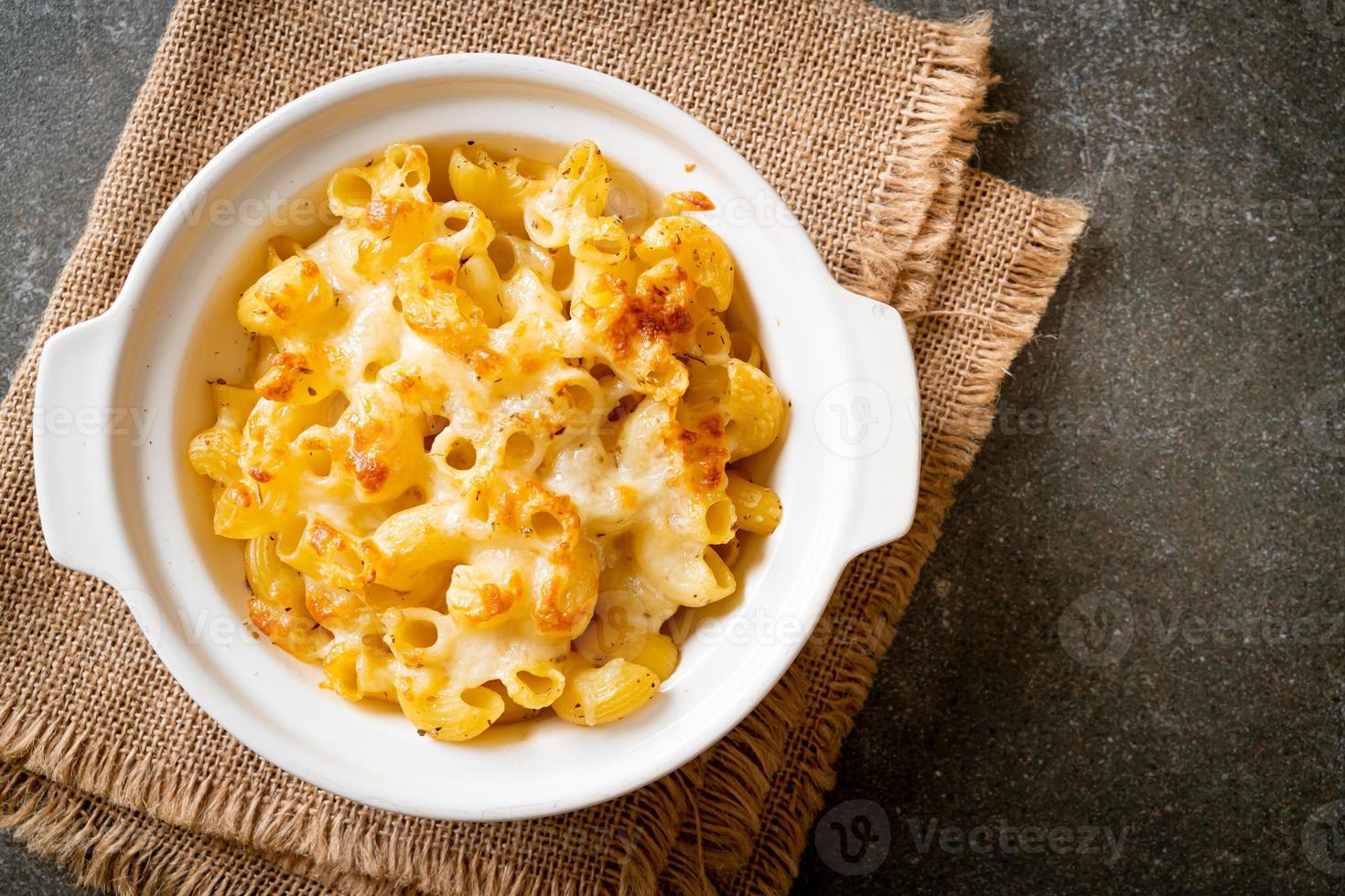 American mac and cheese, macaroni pasta in cheesy sauce photo