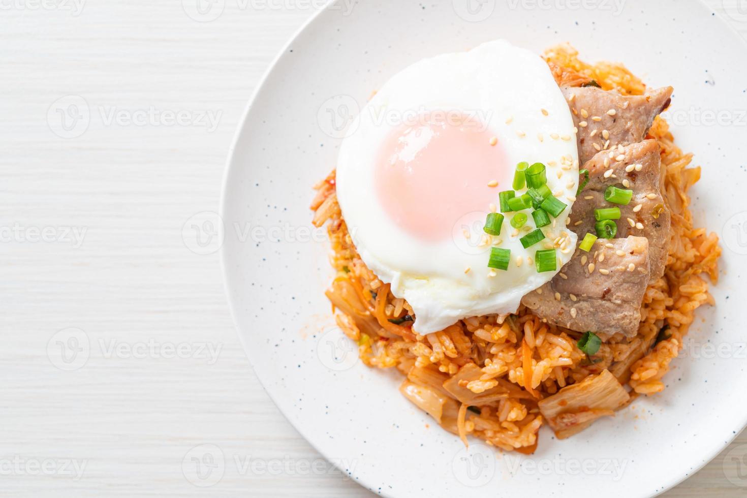 Kimchi fried rice with fried egg and pork photo