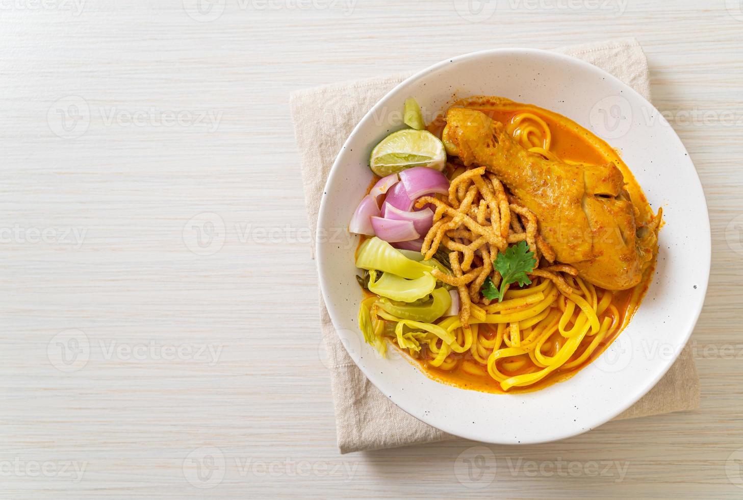 Northern Thai noodle curry soup with chicken photo